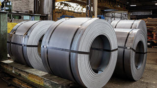 Flat-rolled steel coils at a processing facility