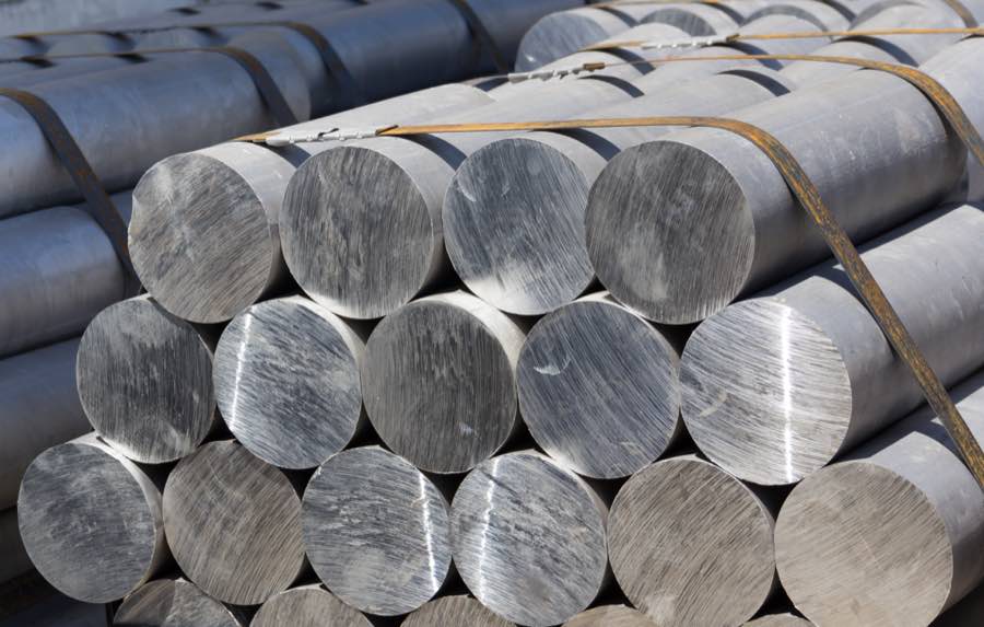 Round steel bars staged in an industrial processing facility