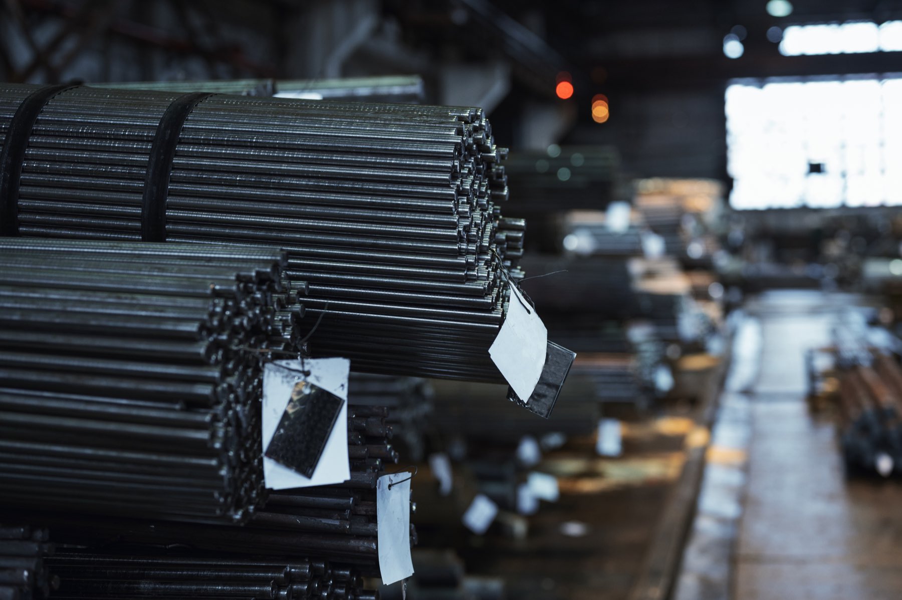 Bundles of steel round bar in a warehouse